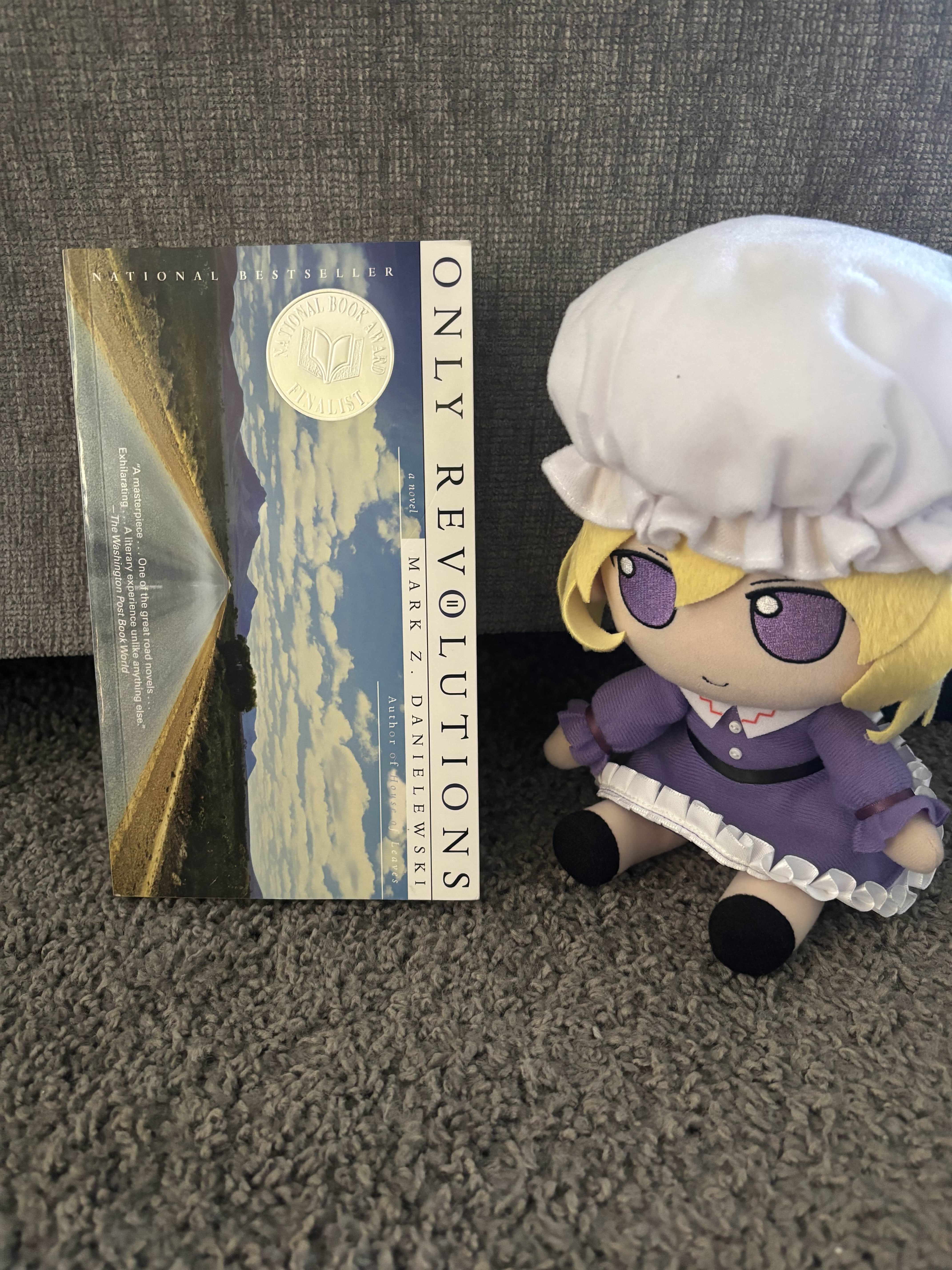 Maribel fumo next to the Hailey cover of Only Revolutions